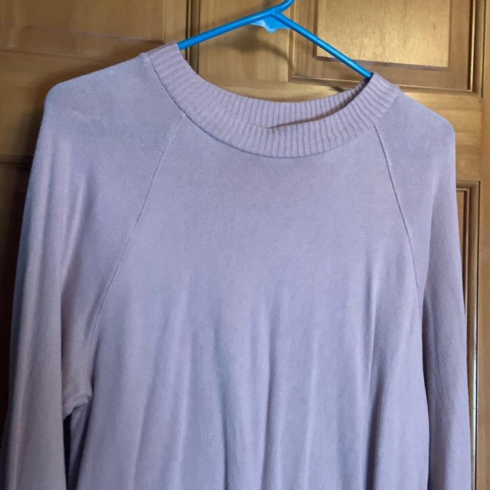 Sweater/top with draw string bottom.